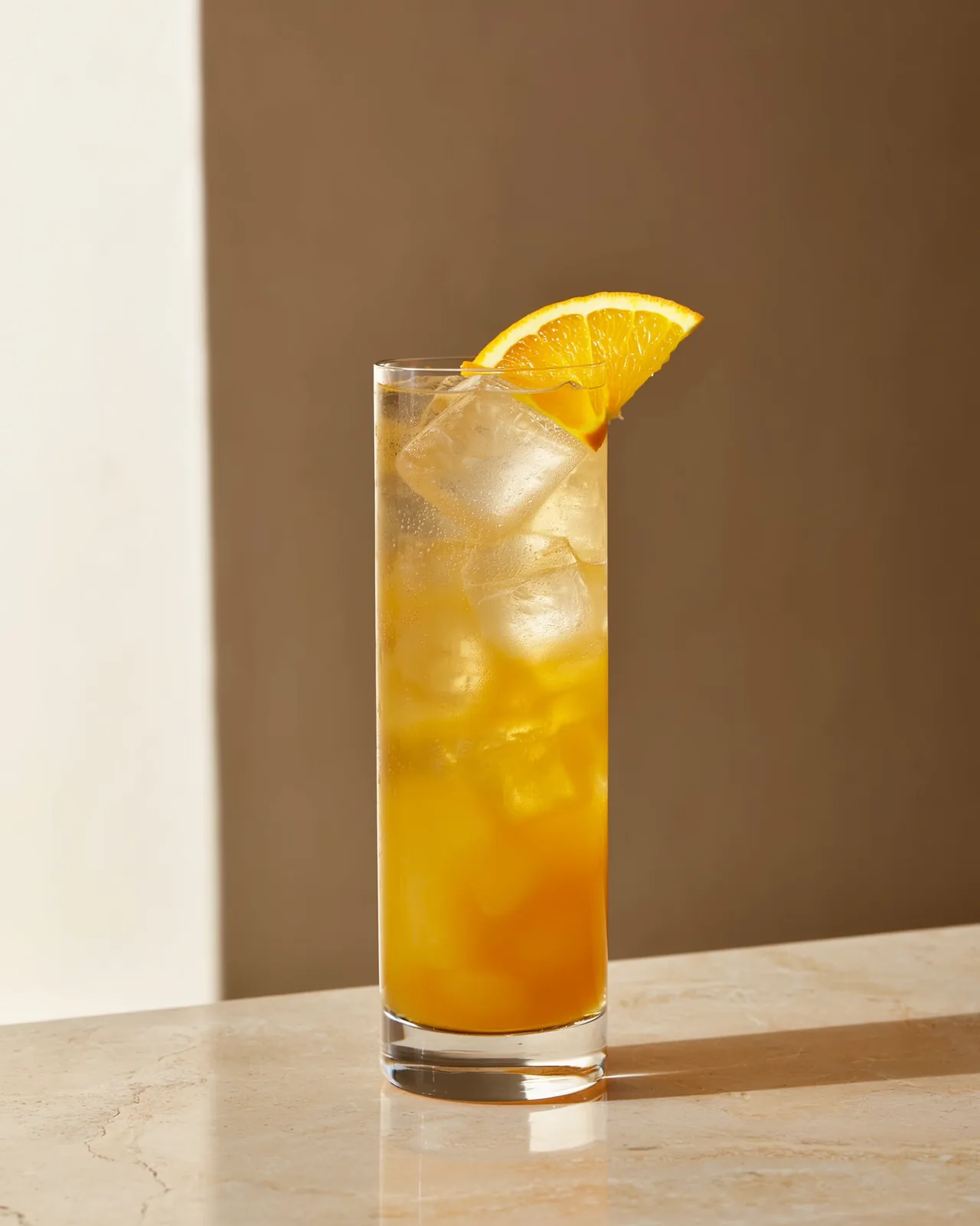 A tall glass with ice holding a HockTail from the Energy family.